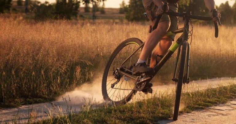 A gravel bike is a type of bicycle designed for off-road riding on unpaved surfaces.