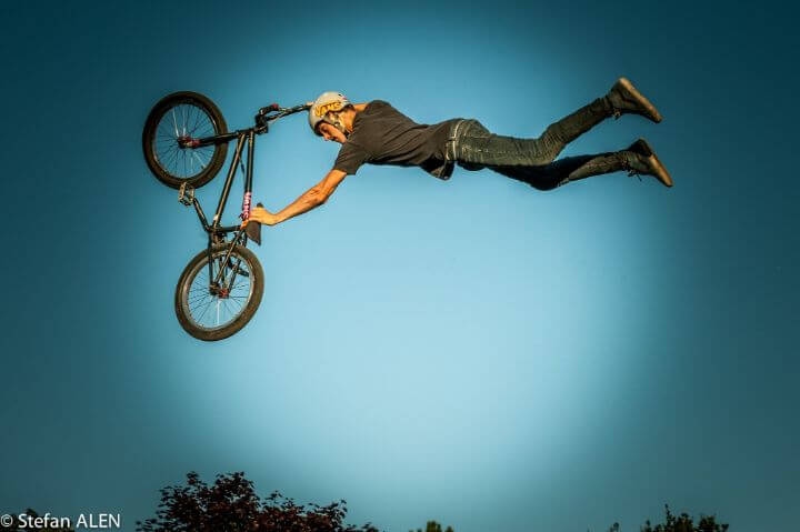 A tail whip is when you jump in the air and whip the back end of the bike around so that it comes back under you.