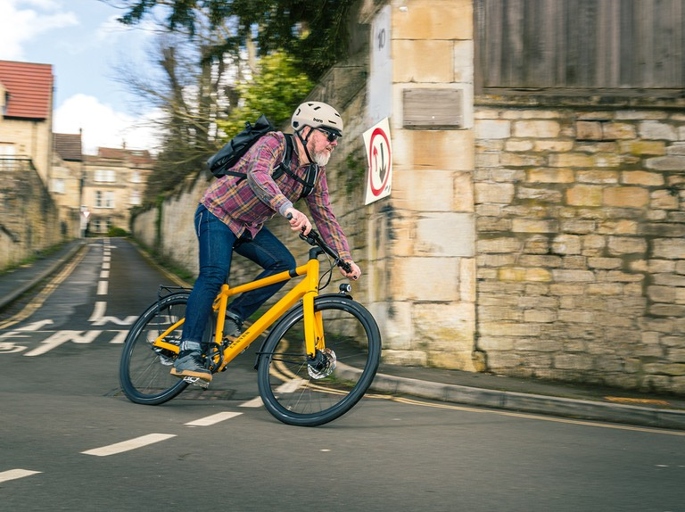 A touring bike is designed for long-distance riding, while a hybrid bike is a more versatile option that can be used for both commuting and recreation.