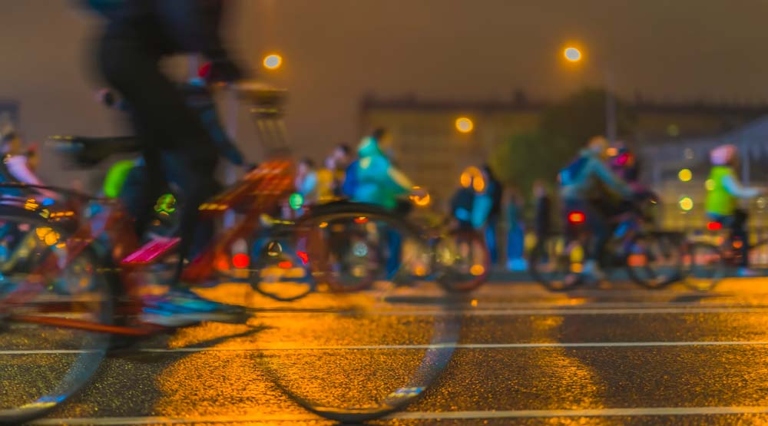 If you are biking in the rain, be extra visible for vehicles by wearing bright colors.