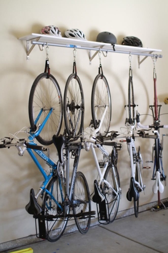 The best way to hang your bike is by the front wheel.