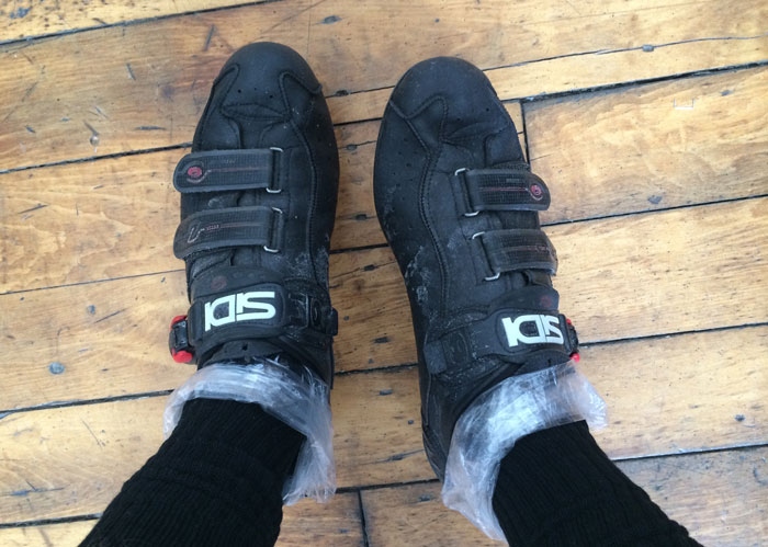 To keep your feet warm while cycling, try the plastic bag trick.